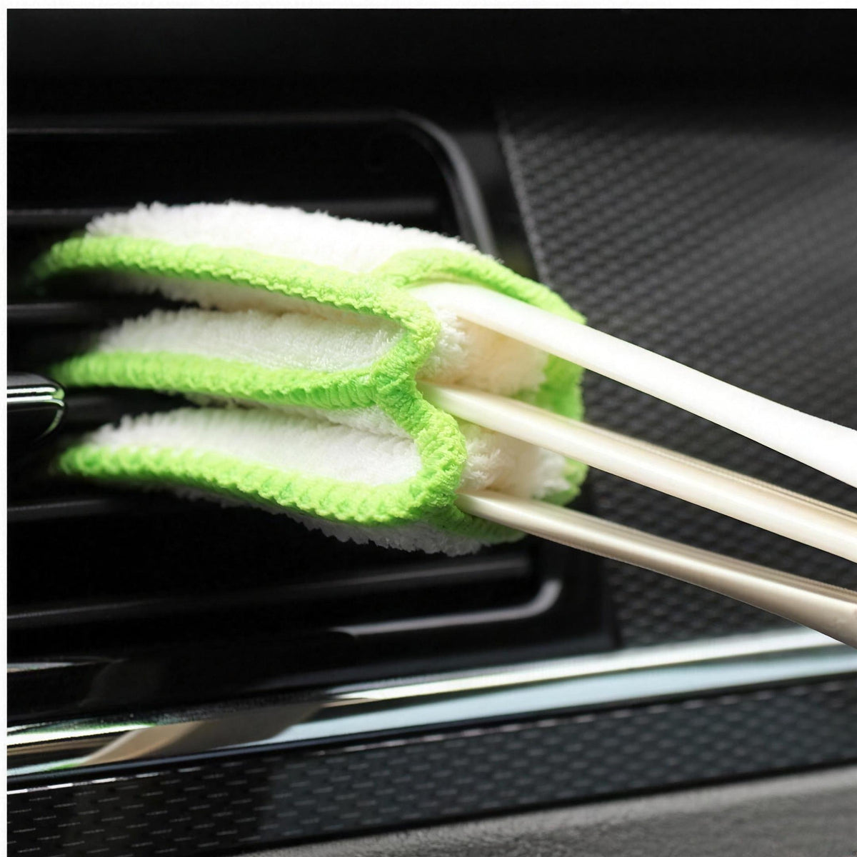 The air-vent brush cleaning between dashboard vent slats