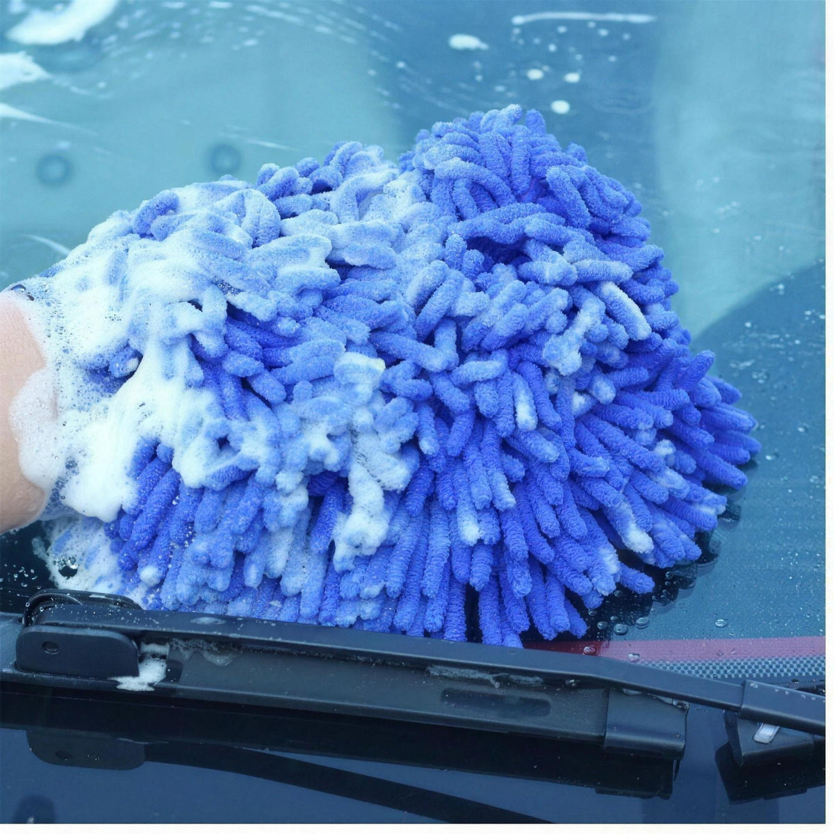The chenille wash mitt soaping a windscreen
