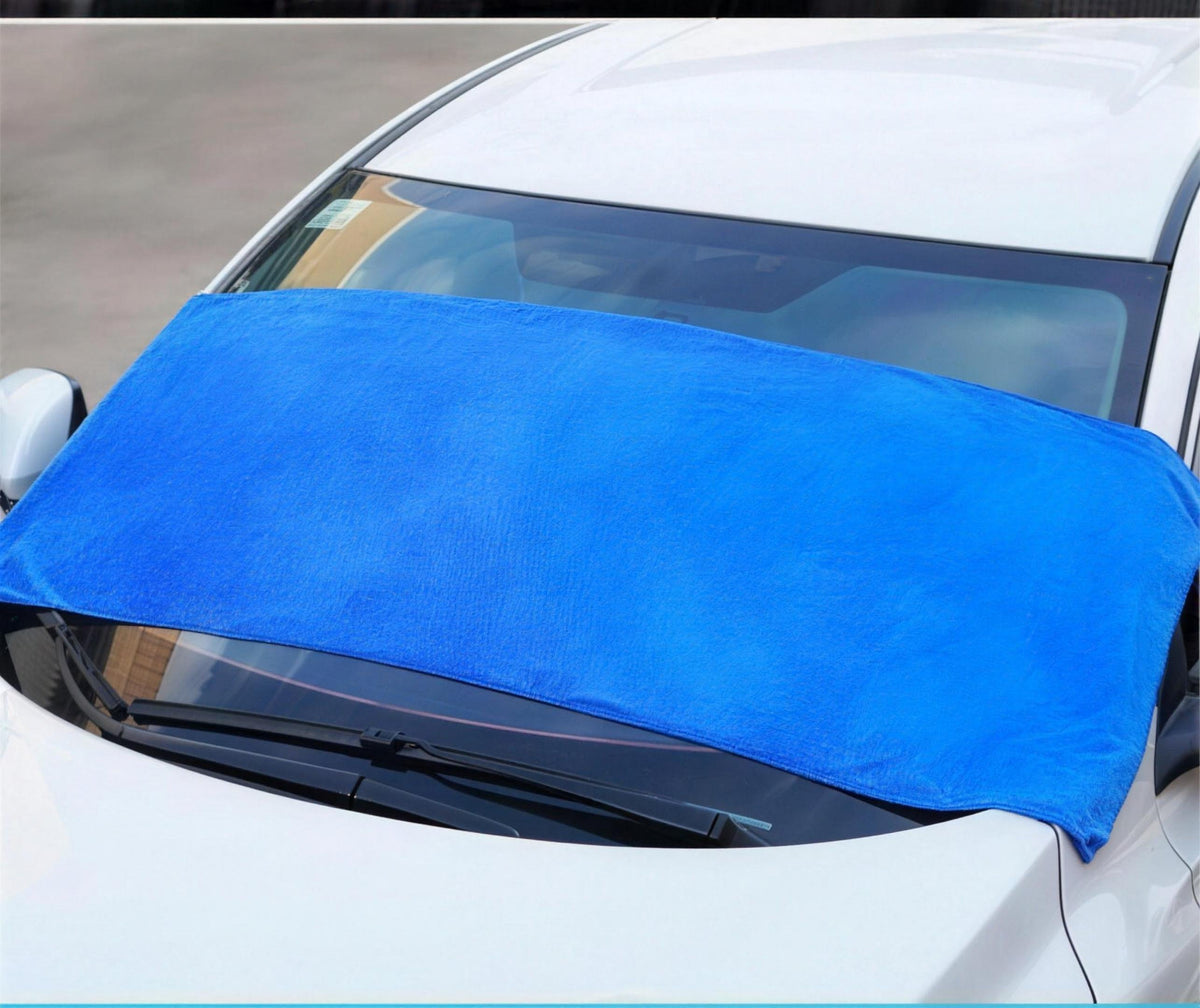 The large microfibre towel drying a windscreen