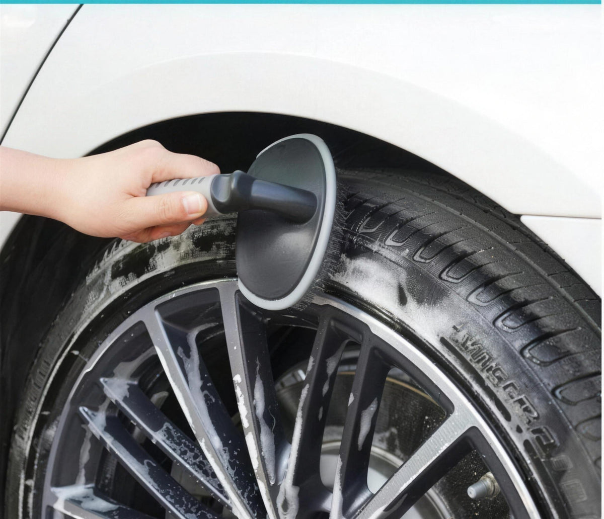 The tyre brush scrubbing a soapy tyre sidewall